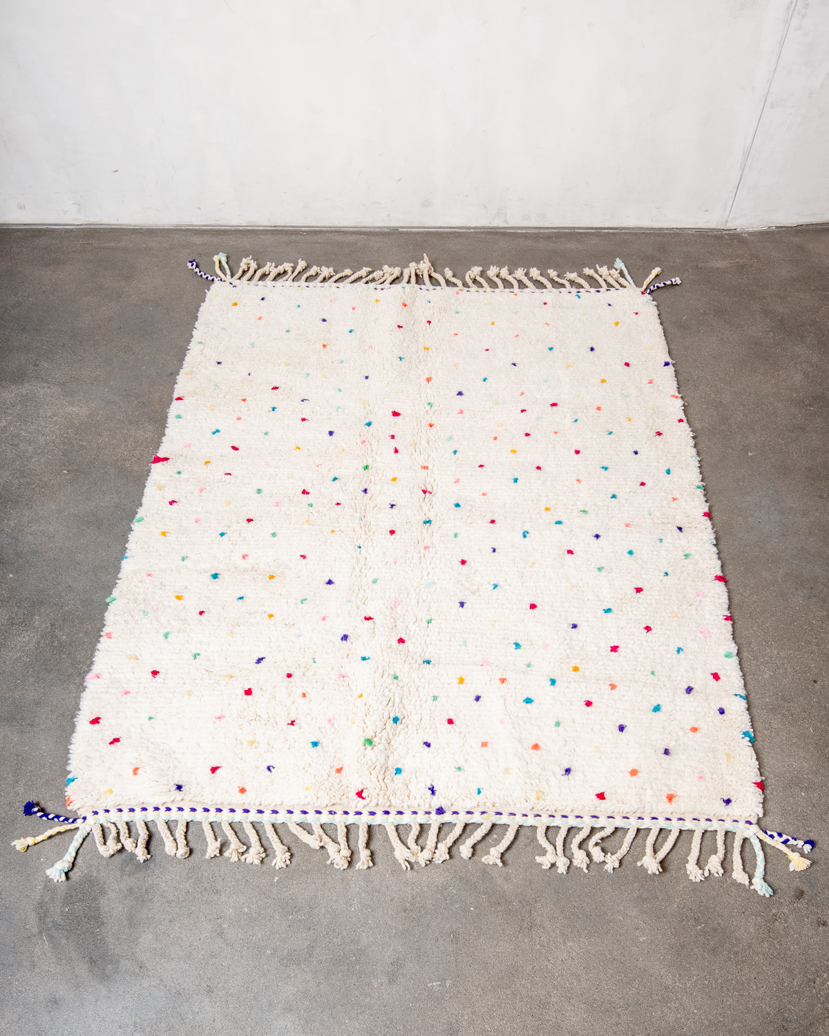 Modern, designer, handcrafted Berber rug from Morocco. Beniourain carpet with beautiful colours and patterns and fluffy wool texture.